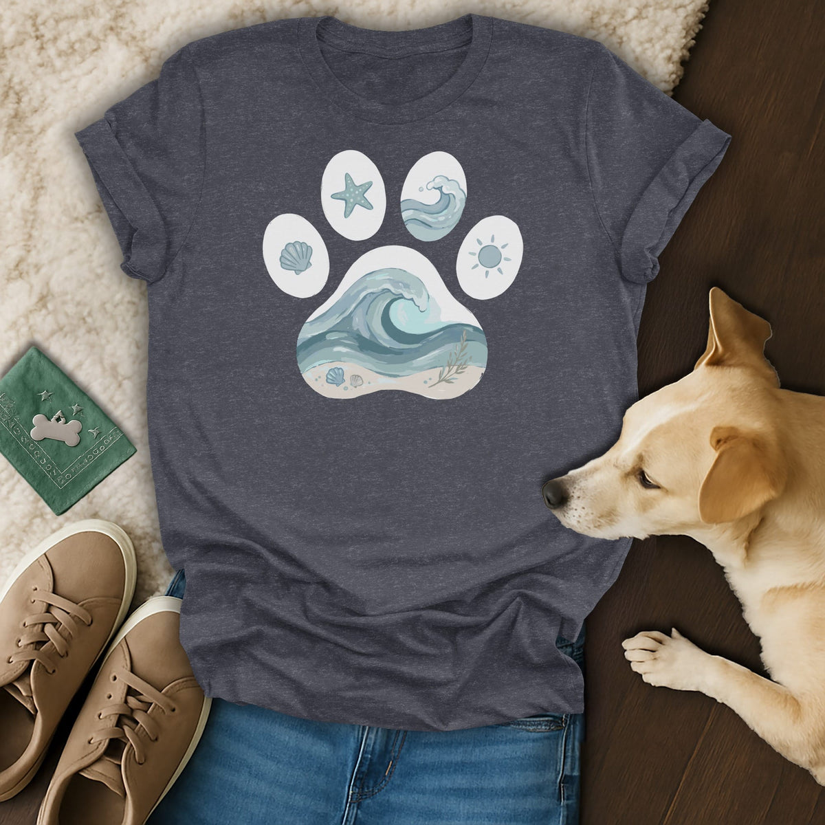 Dark gray t-shirt with a paw print graphic featuring beach and ocean scenes.