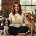 Woman in "Same Stylist" t-shirt with Cavalier King Charles Spaniel and yellow Labrador.