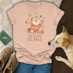 Peach t-shirt with cartoon dog wearing sweater, leaves, pumpkins, and "Fur-st Day Of Fall" text.