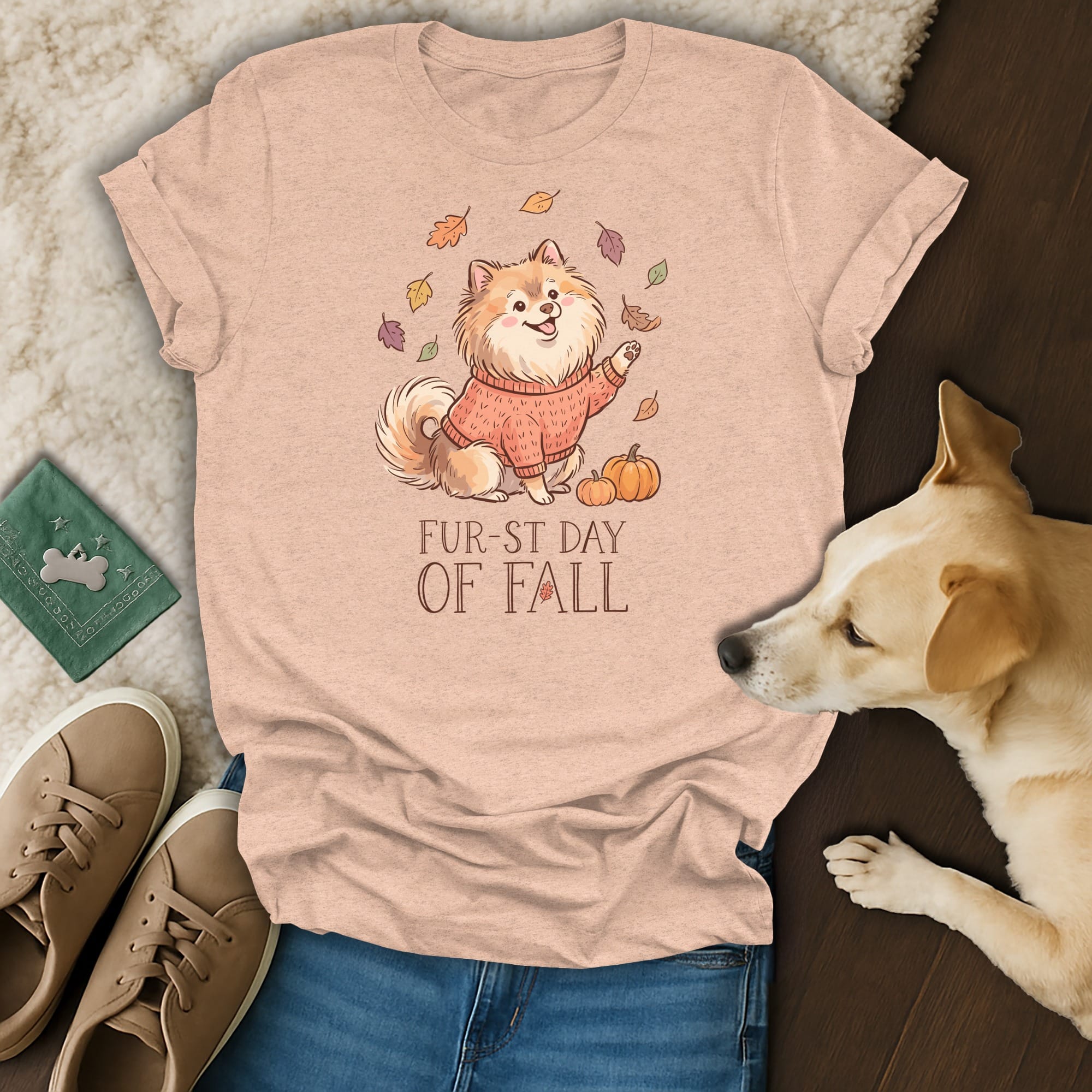 Peach t-shirt with cartoon dog wearing sweater, leaves, pumpkins, and "Fur-st Day Of Fall" text.
