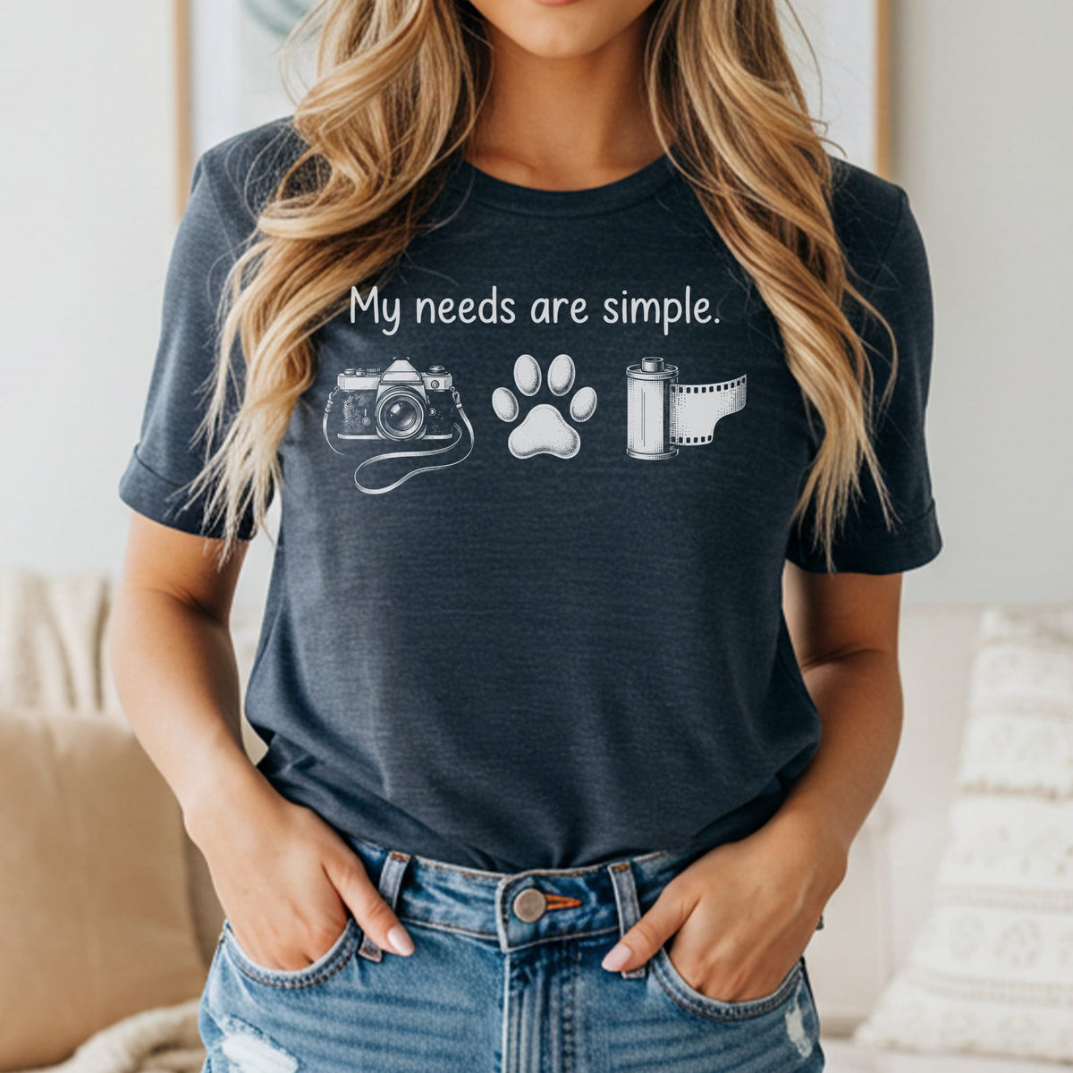 Dark grey t-shirt with white graphic of camera, paw print, and film roll, and text.
