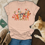 Light pink t-shirt with cartoon dogs playing pickleball.