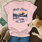 Pink t-shirt with graphic "Mutts About the Lake" and a dog jumping into water.