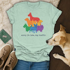 Light teal t-shirt with rainbow dogs graphic and text "sorry i'm late, dog traffic".