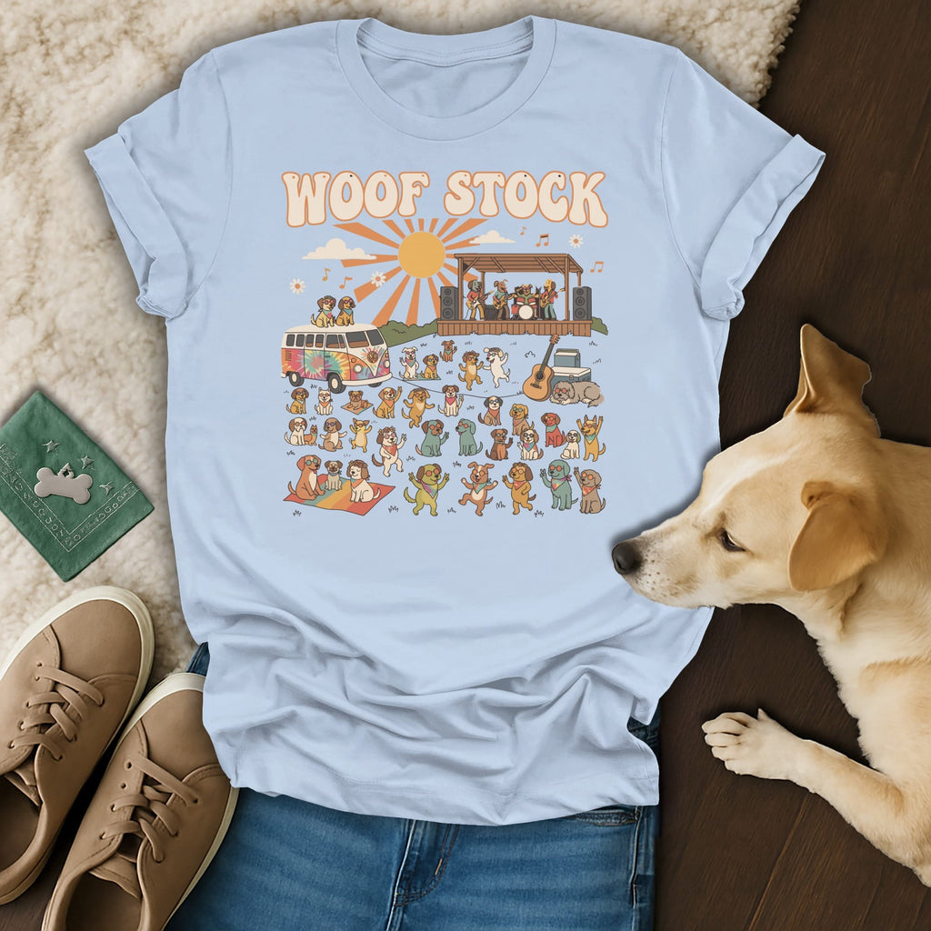Light blue t-shirt with "WOOF STOCK" text and a graphic of dogs at a music festival.