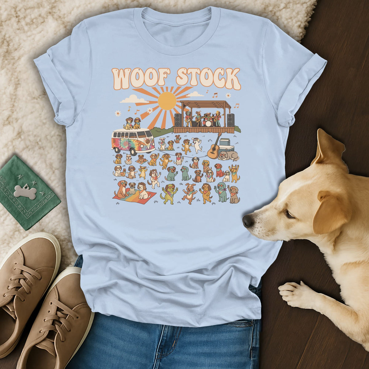 Light blue t-shirt with "WOOF STOCK" text and a graphic of dogs at a music festival.