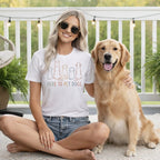 White t-shirt with "HERE TO PET DOGS" text and outline dog graphics.