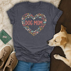 Dark grey t-shirt with "DOG MOM" text inside a heart made of dog-themed icons.
