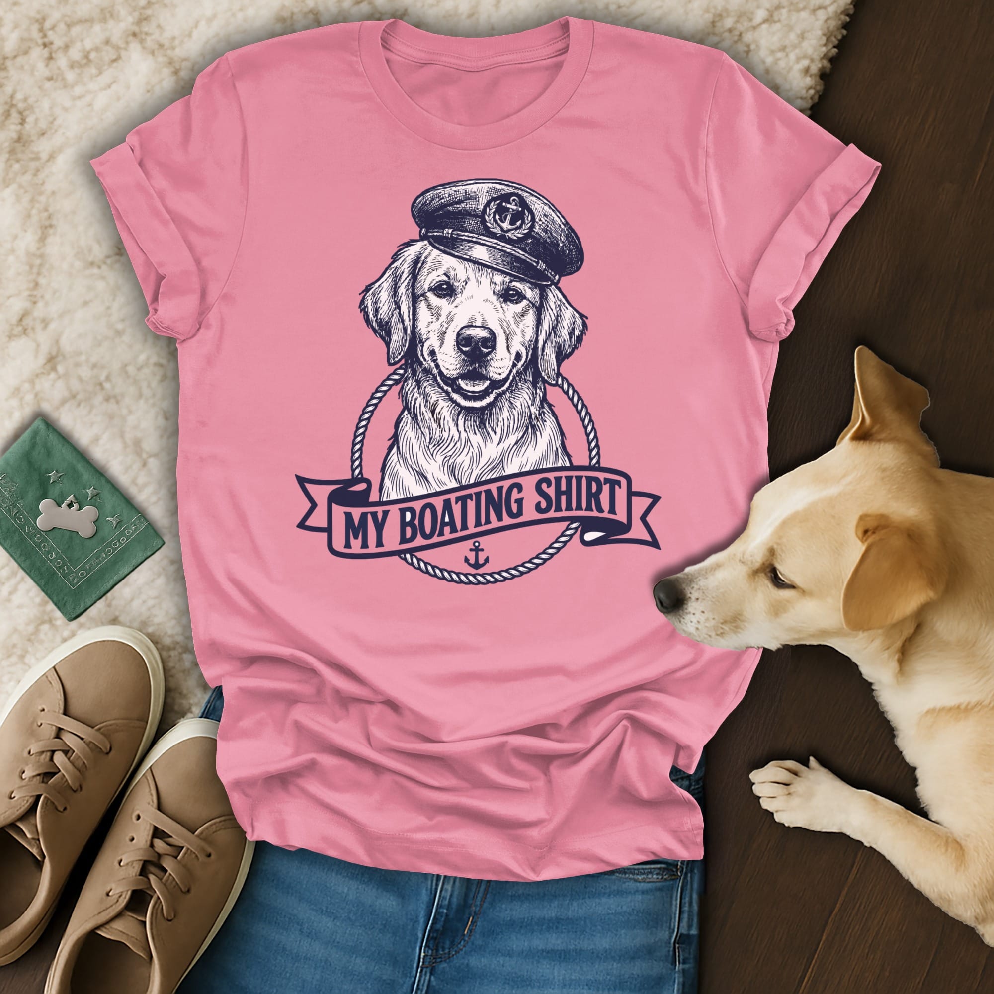 Golden retriever in sailor hat with "MY BOATING SHIRT" text on pink t-shirt.