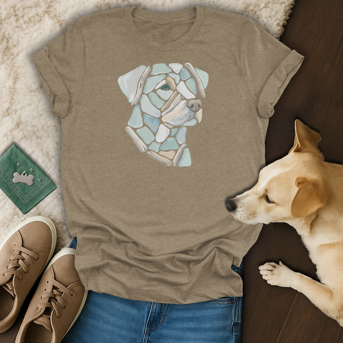 Taupe t-shirt with a mosaic dog face graphic, paired with jeans and sneakers.