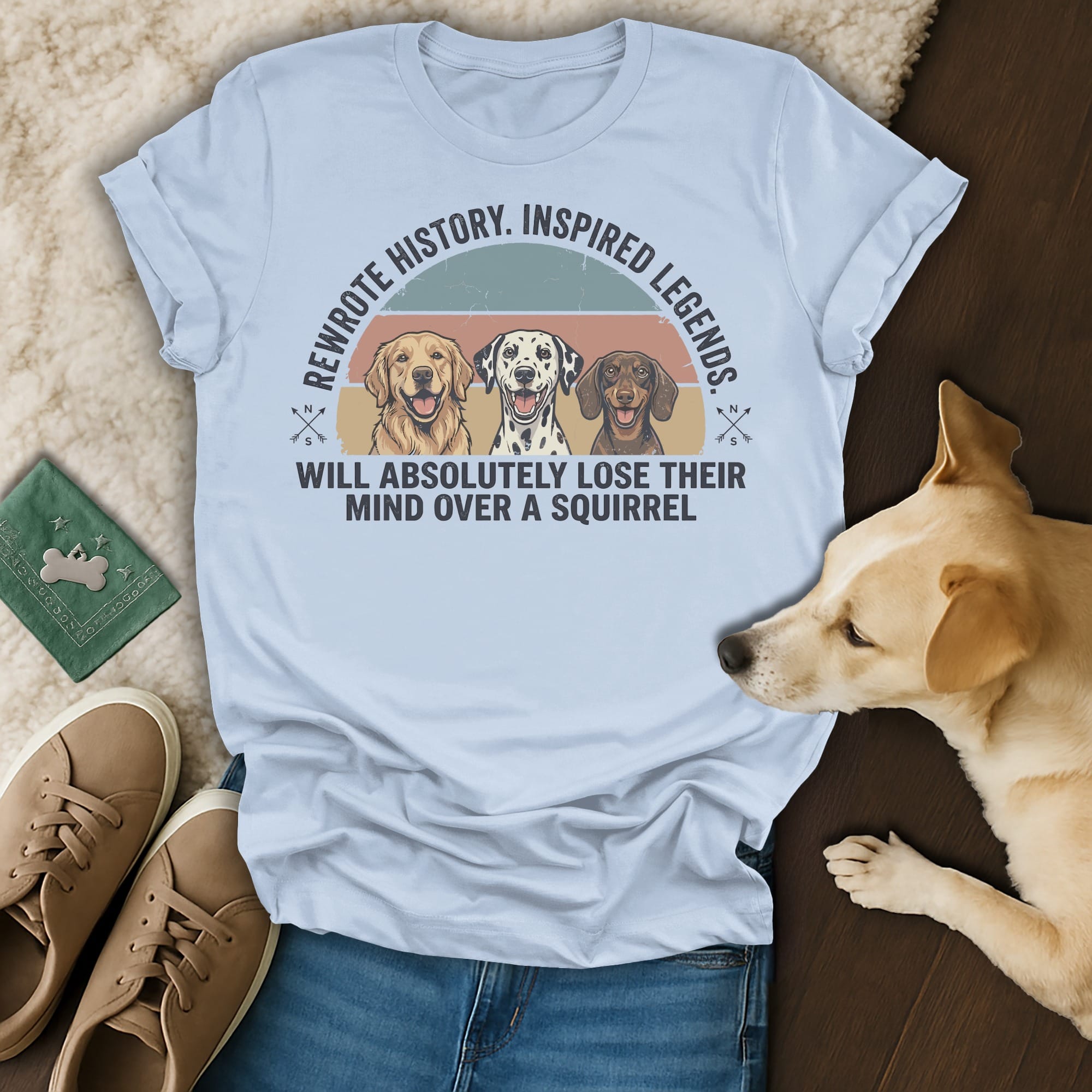 Light blue t-shirt with text "Rewrite history. Inspired legends. Will absolutely lose their mind over a squirrel."