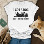 White t-shirt with "I GOT A DOG now I have a curfew" text and a dog graphic.