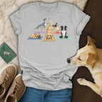 Dogs in yoga poses on mats on a grey t-shirt.
