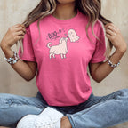 Pink t-shirt with cartoon dog dressed as ghost saying "BOO-P" to a ghost.