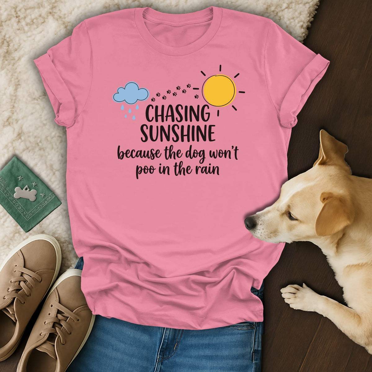 Pink t-shirt with text "Chasing Sunshine Because The Dog Won't Poo In The Rain".