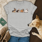 Grey t-shirt with illustration of four French bulldogs in Halloween costumes.