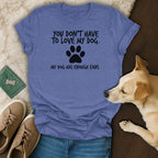 Blue t-shirt with black text reading "YOU DON'T HAVE TO LOVE MY DOG. MY DOG HAS ENOUGH FANS."