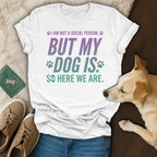 White t-shirt with purple and green text "I AM NOT A SOCIAL PERSON, BUT MY DOG IS SO HERE WE ARE."