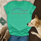 Green t-shirt with "paws across america" text and dog.