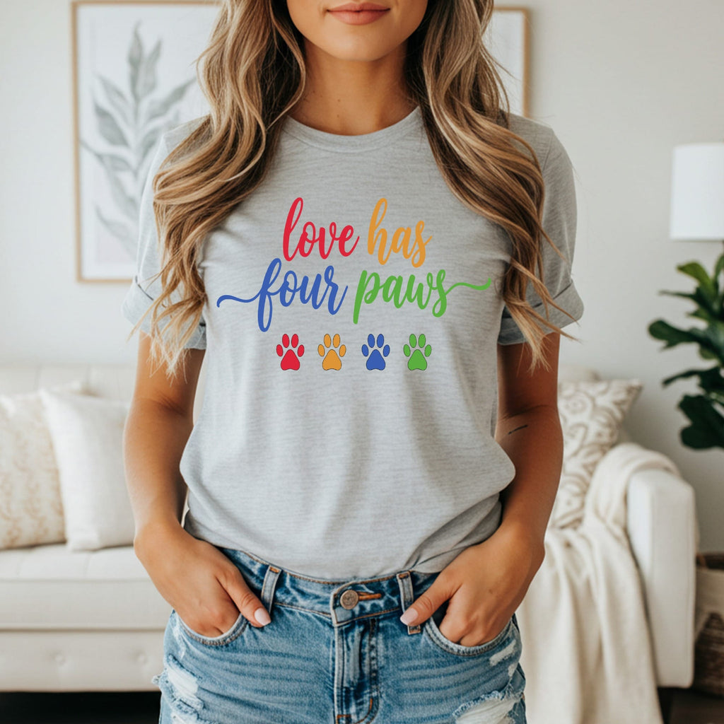 Grey t-shirt with rainbow paw prints and "love has four paws" text.