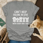 Grey v-neck t-shirt with white text "CAN'T HELP FALLING IN LOVE WITH EVERY DOG I SEE" and dog graphics.