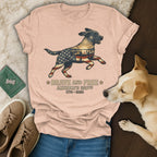 T-shirt with distressed American flag overlaying a running dog, text reads "Brave and Free America's 250th".