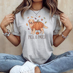 Golden retriever with pumpkin body and autumn leaves, text "Pick of the Patch".
