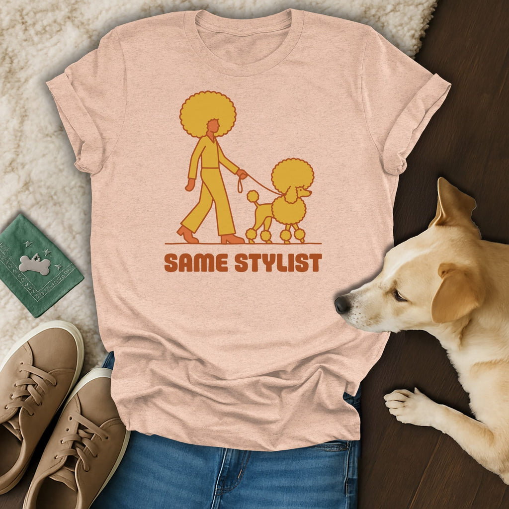 Pink t-shirt with a poodle and person graphic and text "SAME STYLIST".