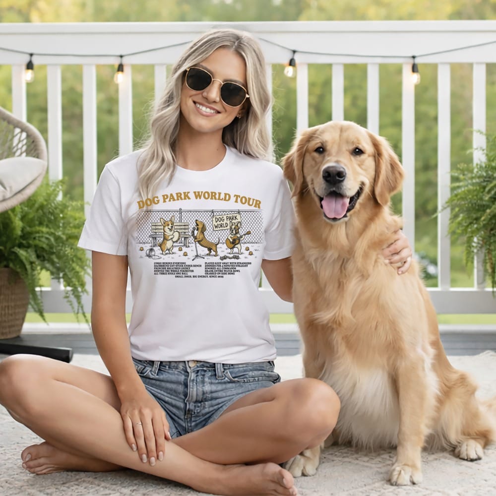 Woman wearing a "DOG PARK WORLD TOUR" t-shirt with dog illustrations.
