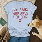 Light blue t-shirt with red text "JUST A GIRL WHO LOVES HER DOG" and paw print.