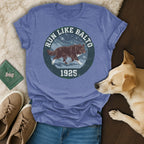 T-shirt with dog illustration, "Run Like Balto 1925" text.