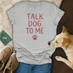 Gray t-shirt with red text "TALK DOG TO ME" and paw print.