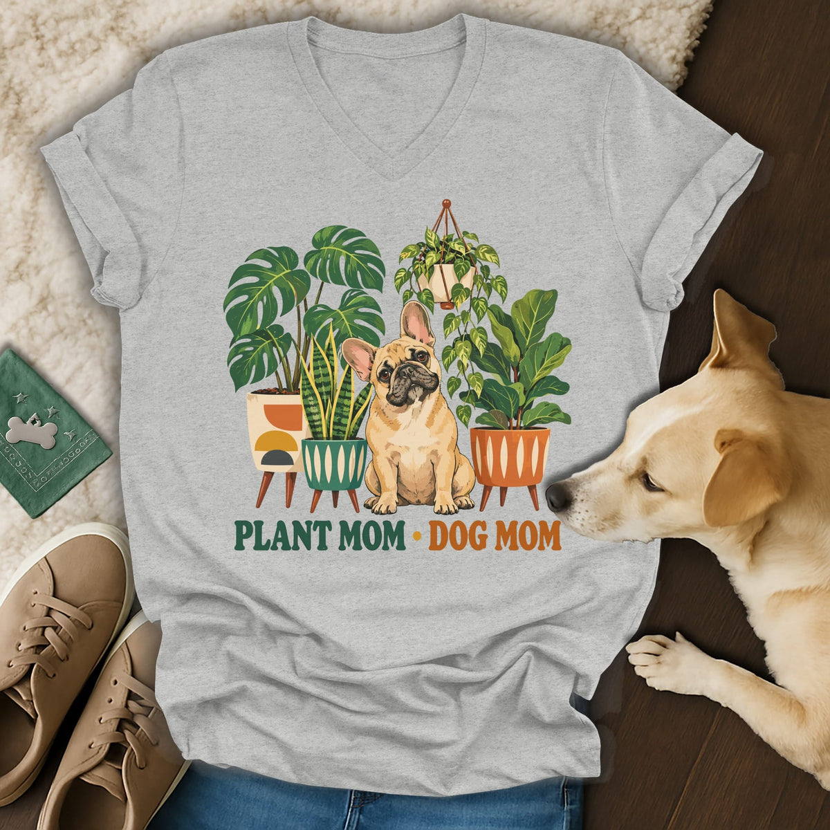 Light gray v-neck t-shirt featuring a French bulldog surrounded by potted plants and the text PLANT MOM DOG MOM.