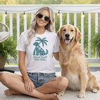 Woman and golden retriever with "Island Heart Dog Soul" t-shirt graphic.