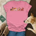 Pink t-shirt with cartoon dogs in festive costumes: witch, turkey, Santa, party.