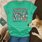 Green t-shirt with "Let Freedom Drool 250 America's 250th - 1776-2026" and bulldog graphics.