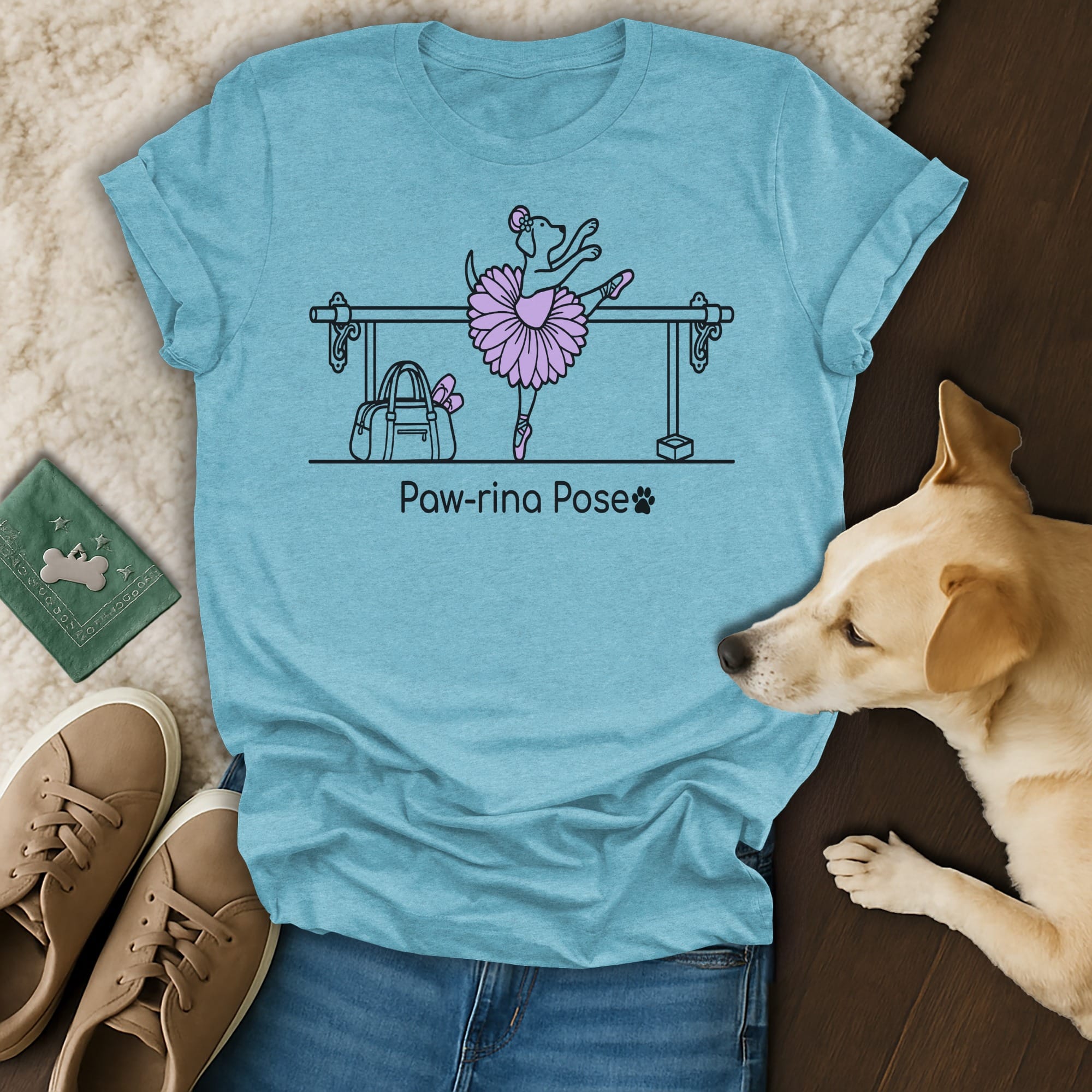 Blue t-shirt with cartoon dog in ballet tutu and barre.