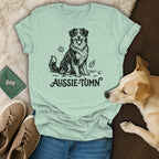 T-shirt with black illustration of an Australian Shepherd and "Aussie-Tumn" text.