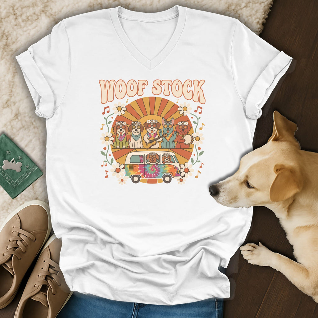 White t-shirt with "Woof Stock" text and cartoon dogs in a van.