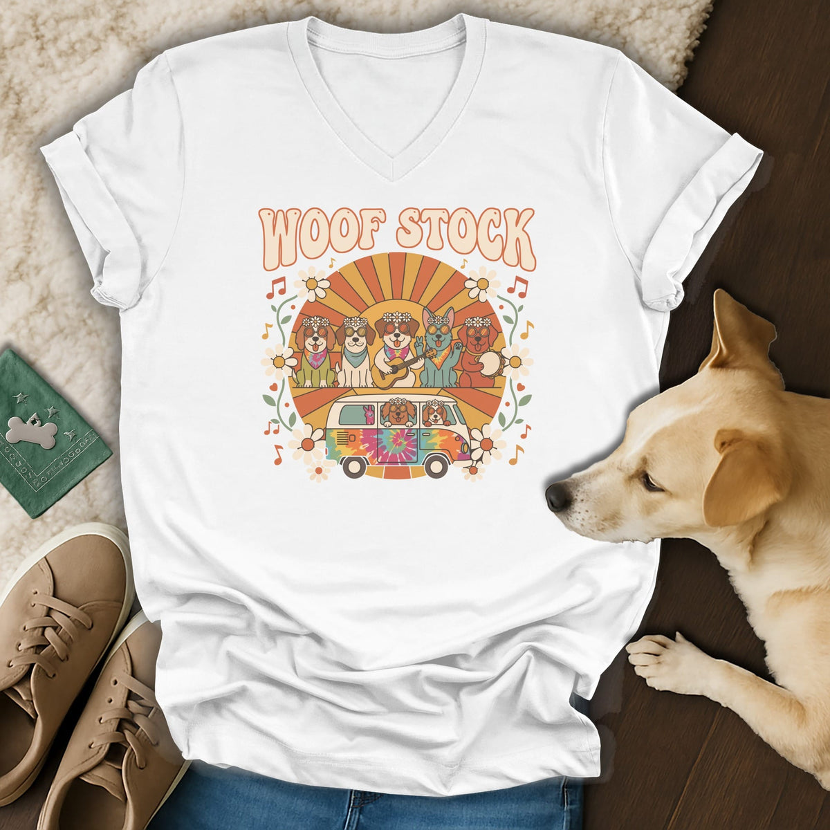White t-shirt with "Woof Stock" text and cartoon dogs in a van.
