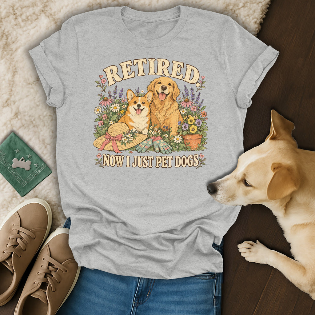 Gray crewneck t-shirt featuring a graphic of two dogs, flowers, and the text Retired Now I Just Pet Dogs.