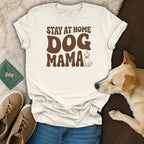 Cream t-shirt with "Stay at Home Dog Mama" text and a dog illustration.
