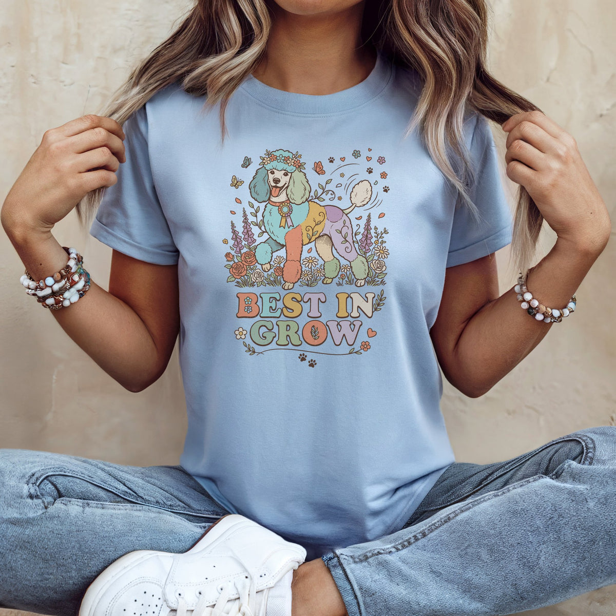 Light blue t-shirt with a colorful poodle graphic and the text "BEST IN GROW".