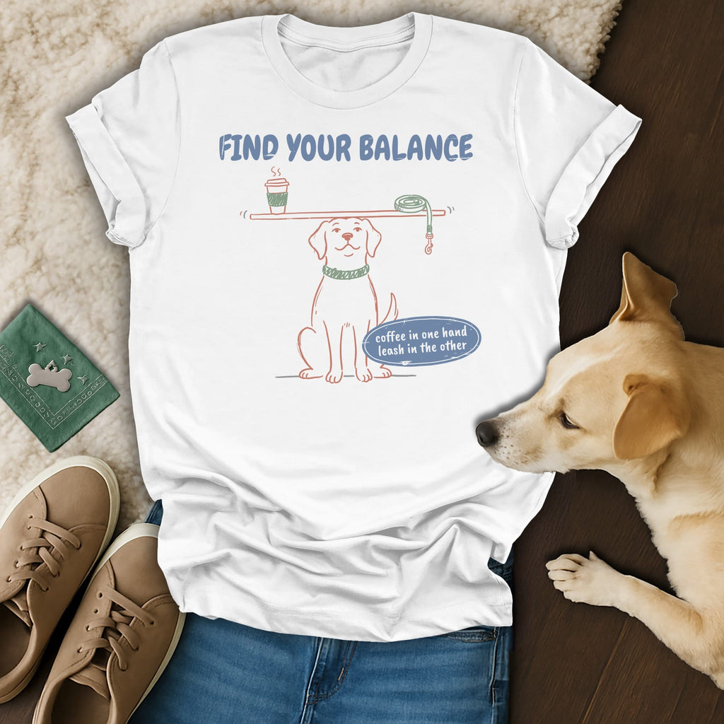 White t-shirt graphic: dog balancing coffee and leash, text "Find Your Balance."