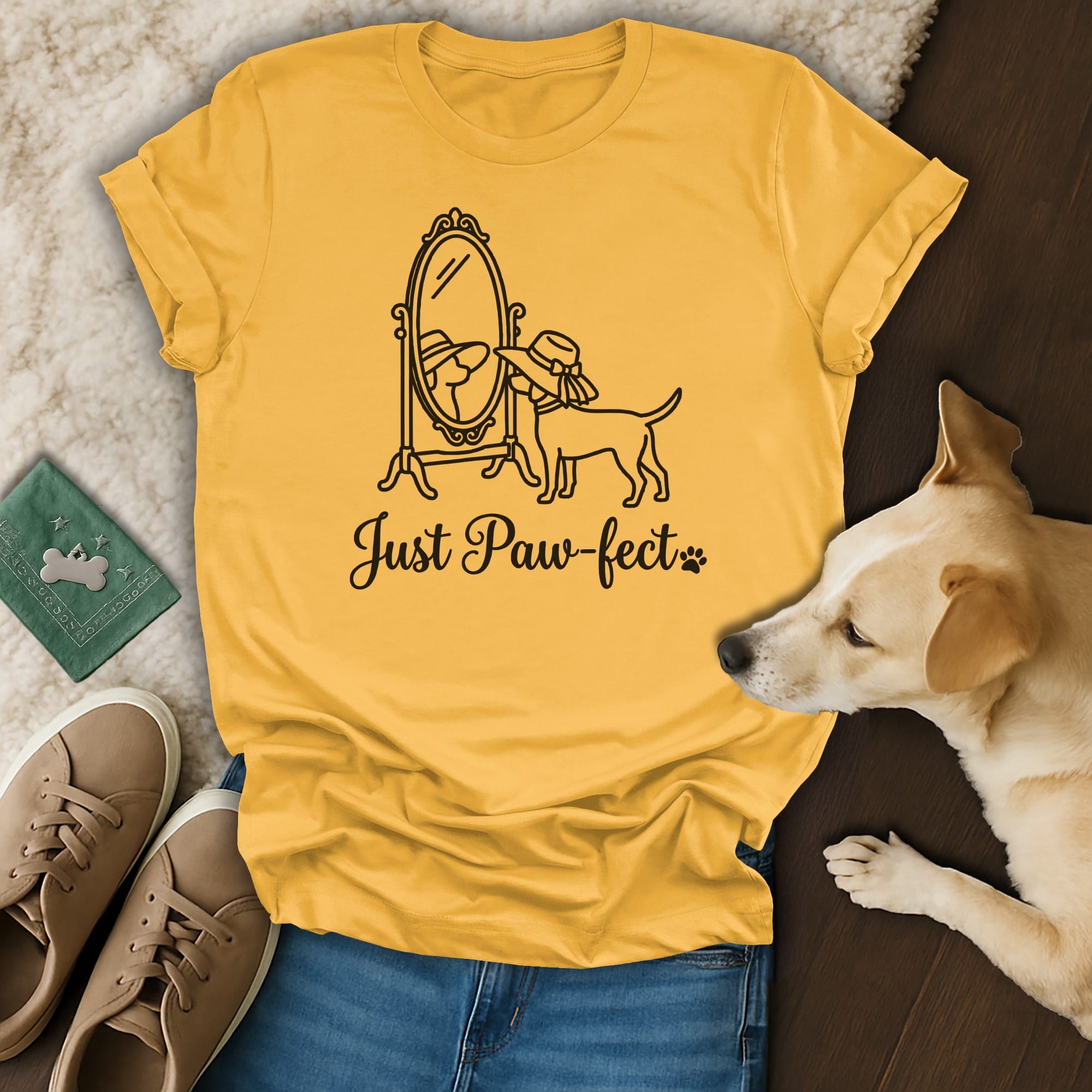 Yellow t-shirt with "Just Paw-fect" text and dog looking in a mirror.