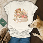 A cream-colored t-shirt featuring a vintage illustration of a puppy in a teacup with the text Tea Gardens and Granddogs.