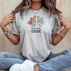 Light gray t-shirt with cartoon dogs and a goose graphic, reading "dog, dog, GOOSE".