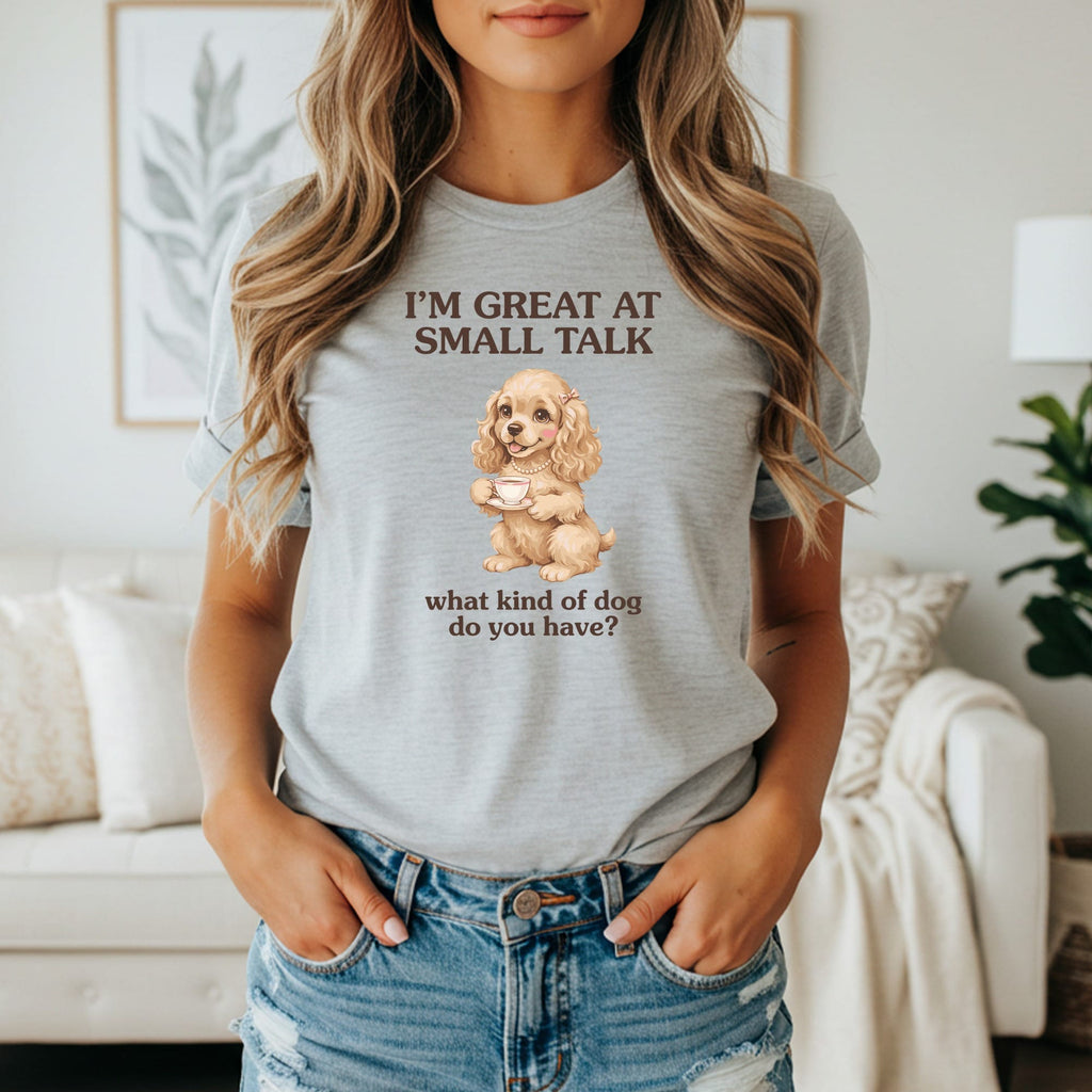 Grey t-shirt with text "I'M GREAT AT SMALL TALK" and dog with teacup.