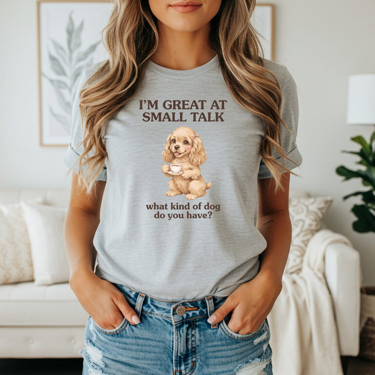 Grey t-shirt with text "I'M GREAT AT SMALL TALK" and dog with teacup.