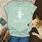 Light blue t-shirt with a cartoon dog holding coffee and wine. "Coffee's supposed to go first. Today wine cut the line. I'm staying OUT OF IT."